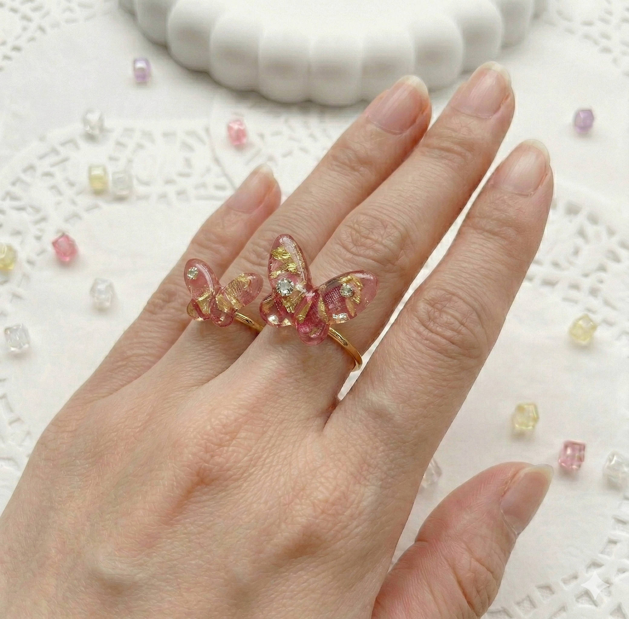 Butterfly motif ring worn on hand